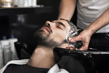 man getting his hair washed at the salon