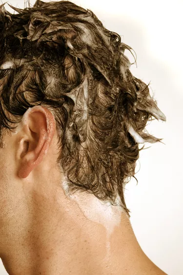 shampoo on a man's hair