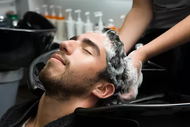 Man getting his hair washed at a salon