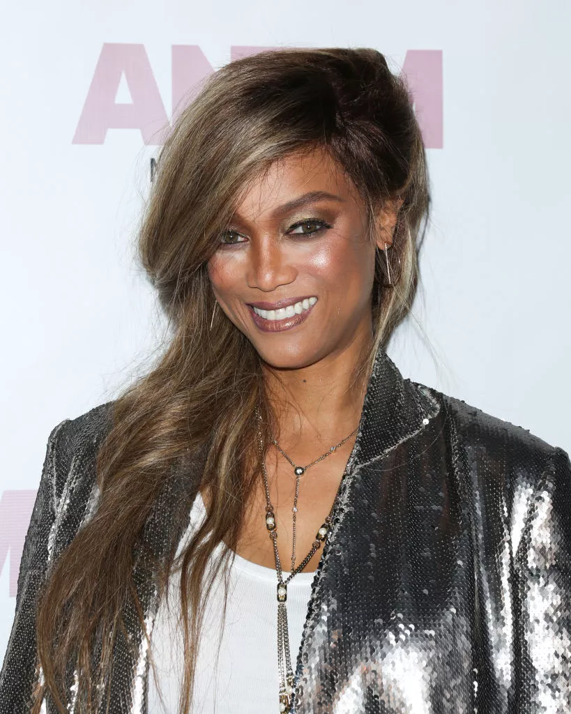 Tyra Banks side-parted long hair