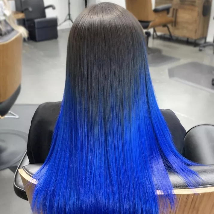 Long, straight hair with a black to blue ombre