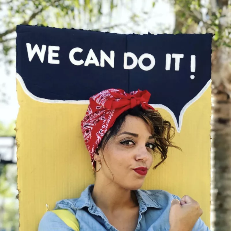 Rosie the Riveter costume including tousled updo with bandana