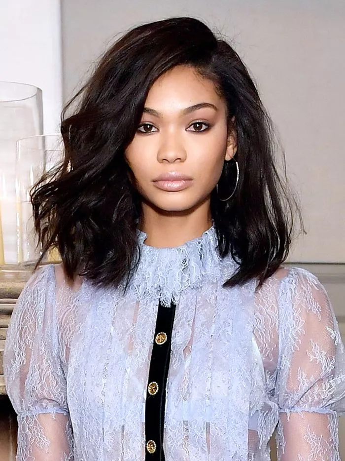 Chanel Iman deep side-parted wavy hair