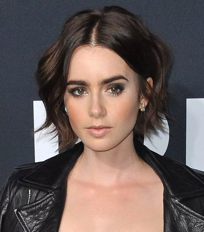 Lily Collins wavy bob with face-framing layers