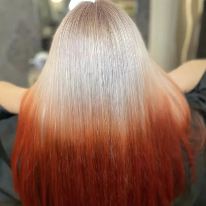 Platinum to red reverse ombre hair