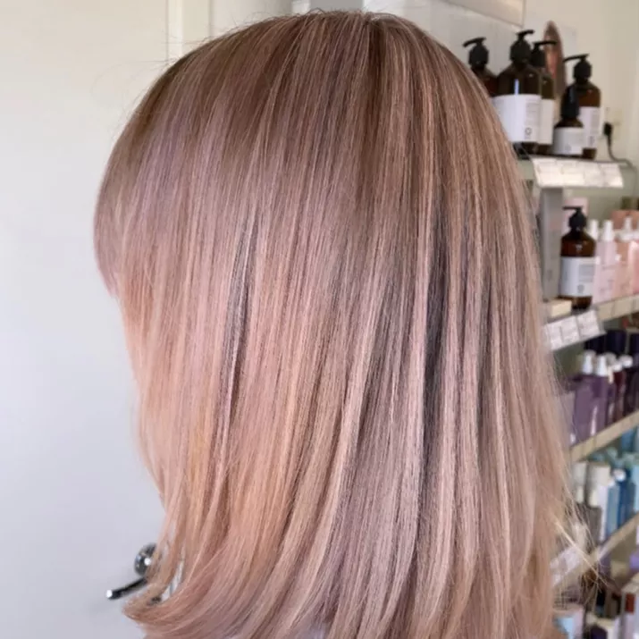 Woman with strawberry blonde long bob