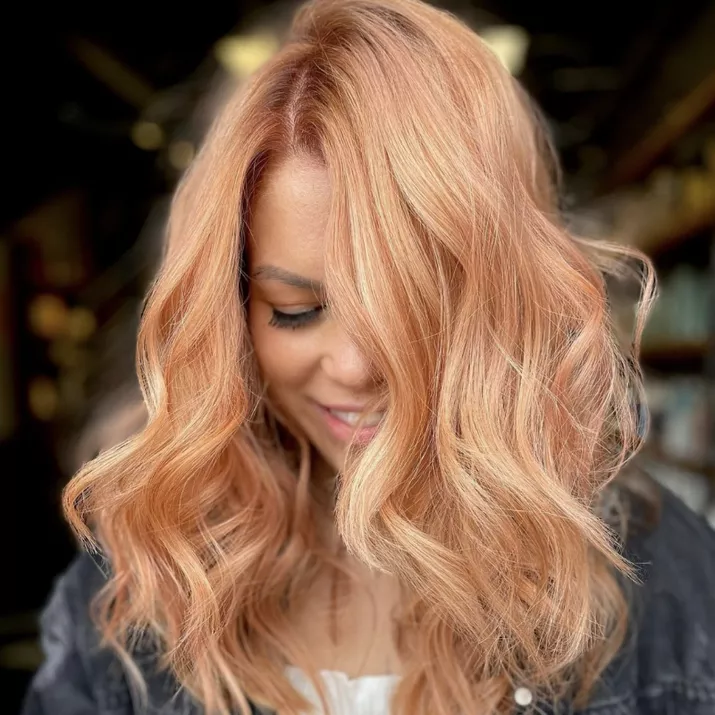 Strawberry blonde hair with subtle highlights