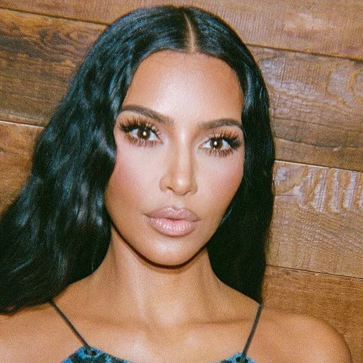Kim Kardashian poses in bronzer and light makeup