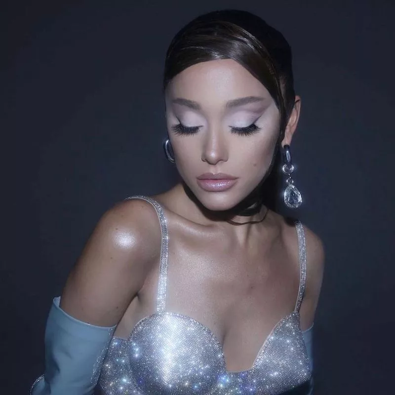 Ariana Grande wears glowing makeup with winged liner from R.E.M. Beauty