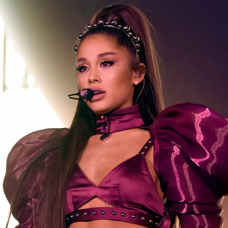 Ariana Grande wears a sparkly makeup look and beaded headband at Coachella
