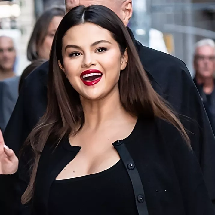 Selena Gomez wears a natural makeup look with red lipstick