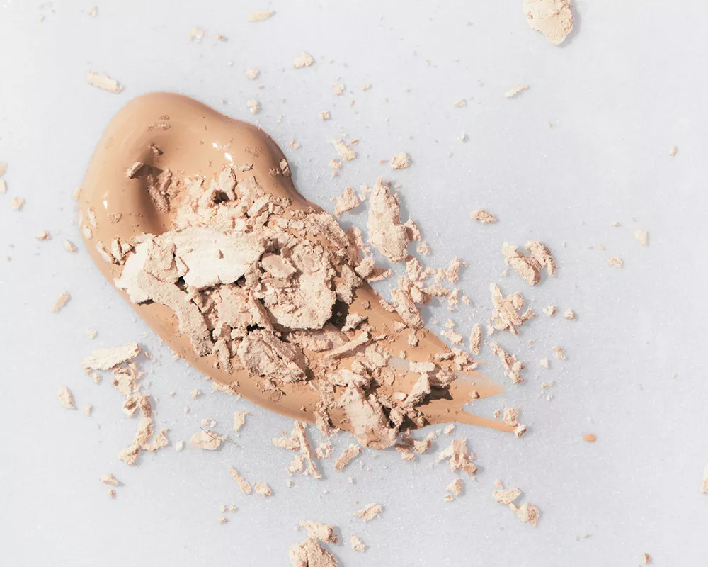 Close up of a cream foundation and a powder foundation