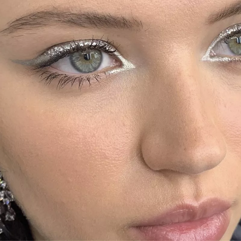 Close-up of metallic silver eyeliner with wing and inner corner outline