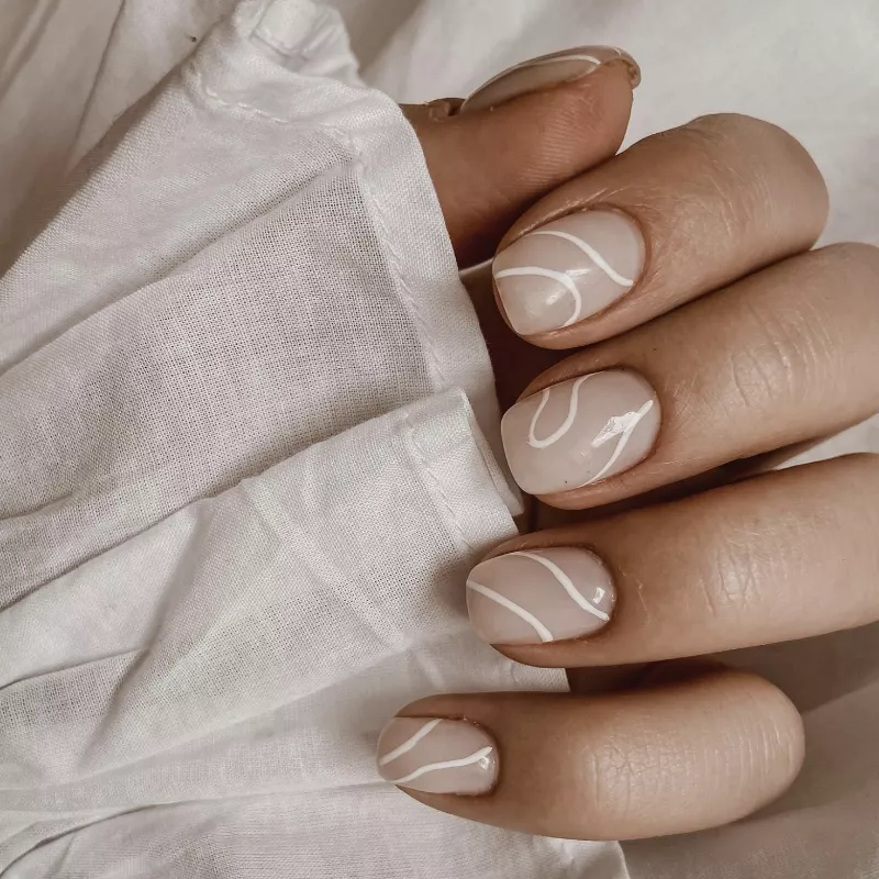 Taupe nails with abstract white lines