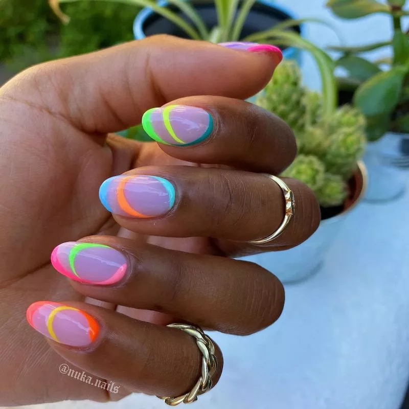 Lavender manicure with rainbow neon abstract curving lines