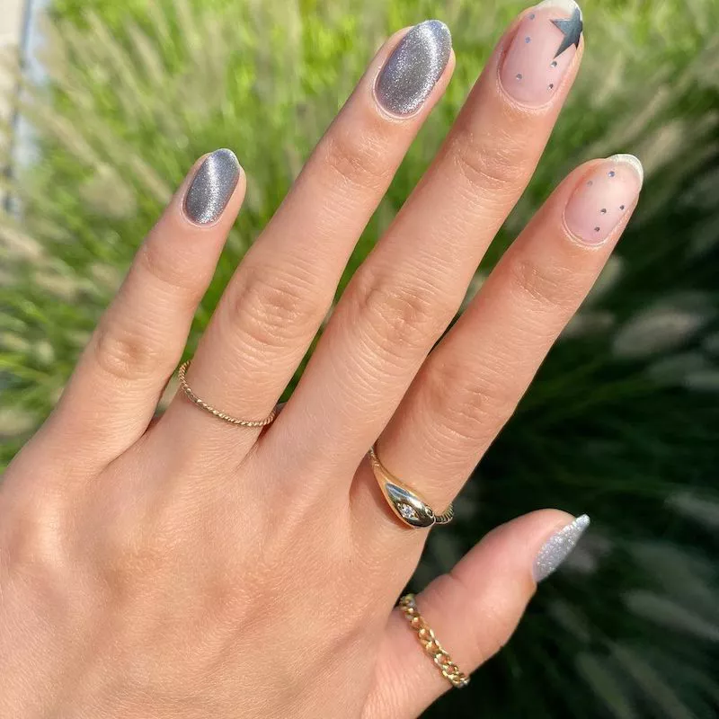 Gray velvet manicure with star accent nails
