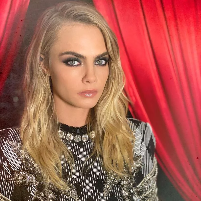 Cara Delevingne wears bold eyebrows and a smoky eye