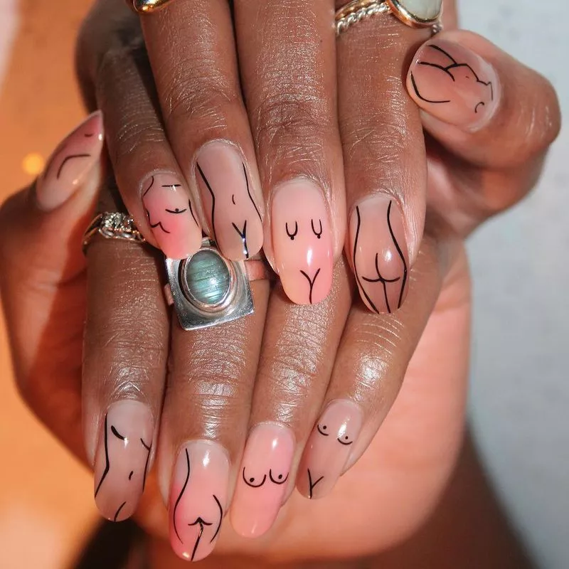 Neutral nails with abstract female form outlines