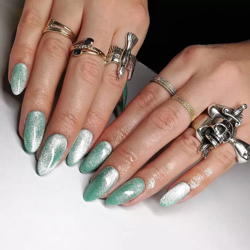Mint green velvet nails and silver rings