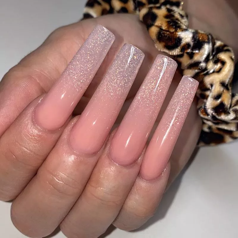 Long silver glitter to peach ombre acrylic manicure