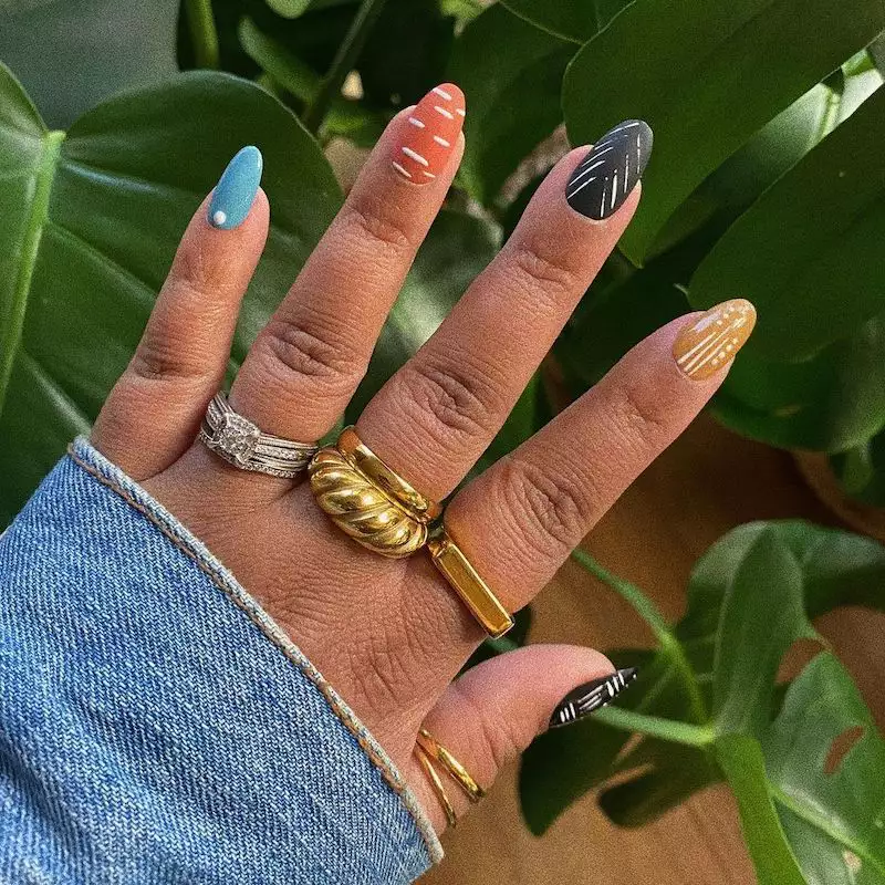 Colorful matte abstract nails with gold rings
