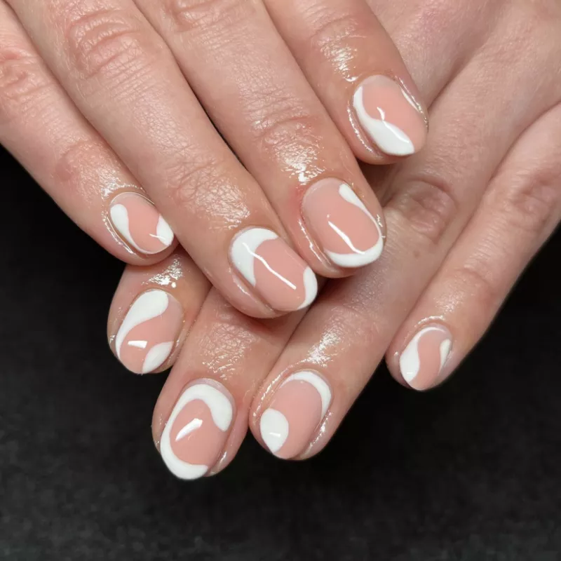Peachy nude nails with white design
