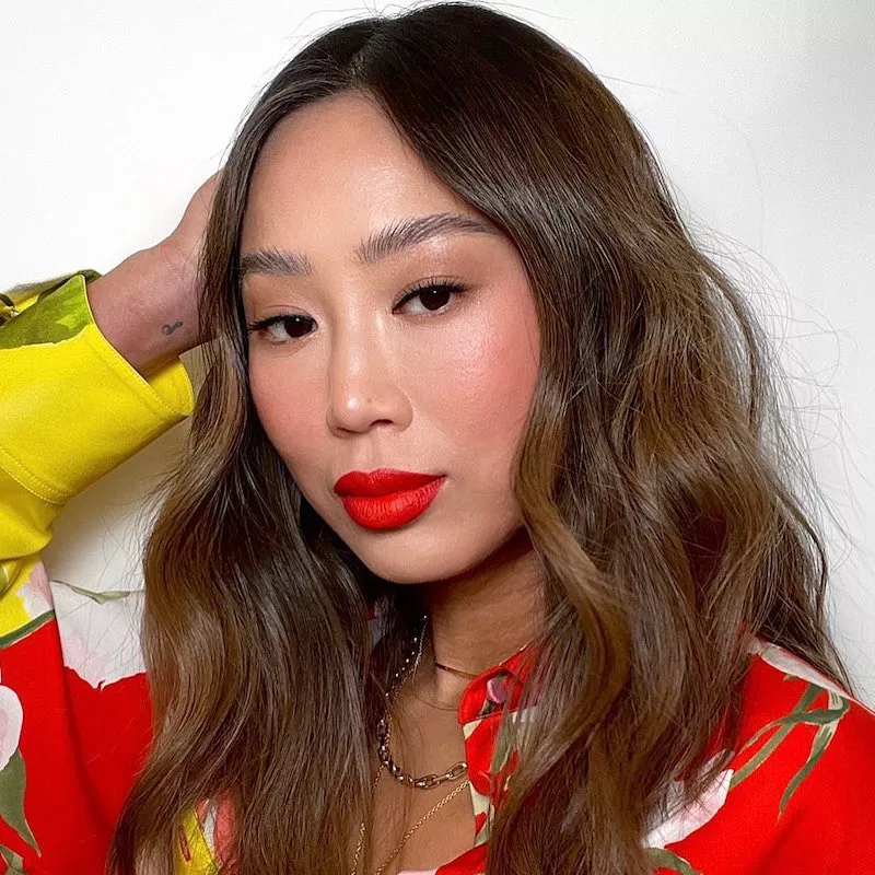 Aimee Song wears classic blush, red lipstick, and subtle mascara