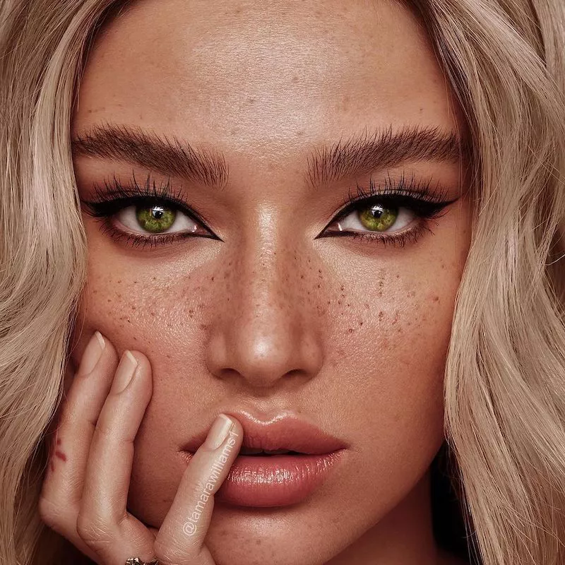 Blonde model with freckles wears a classic everyday reverse cat eyeliner look
