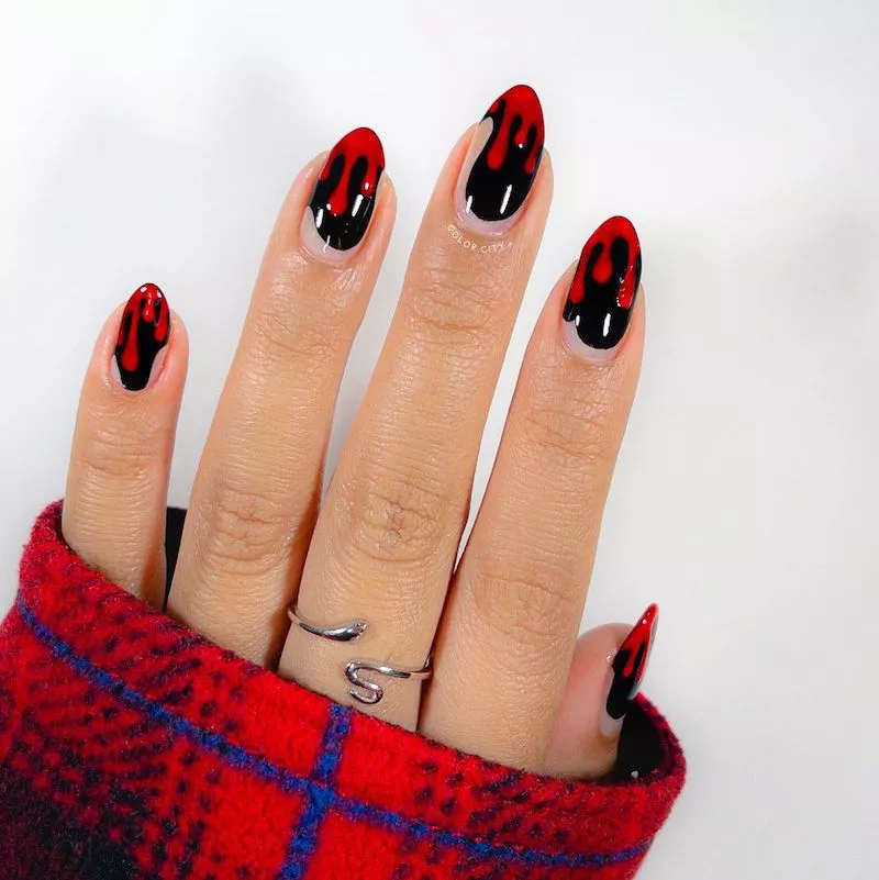 Black and red drip nail design