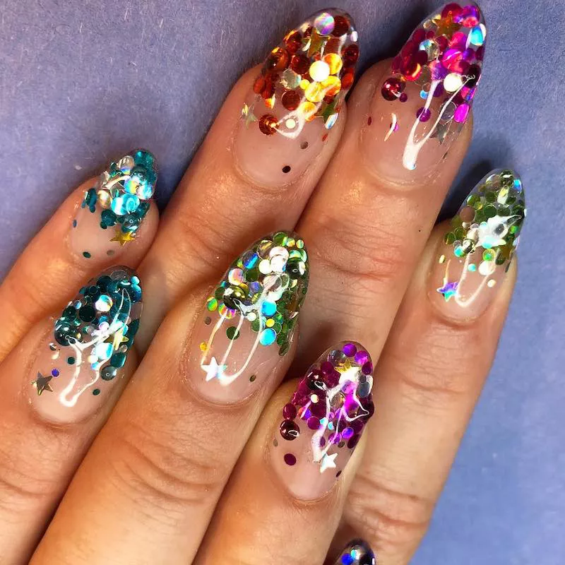 Rainbow confetti dipped almond-shaped nails