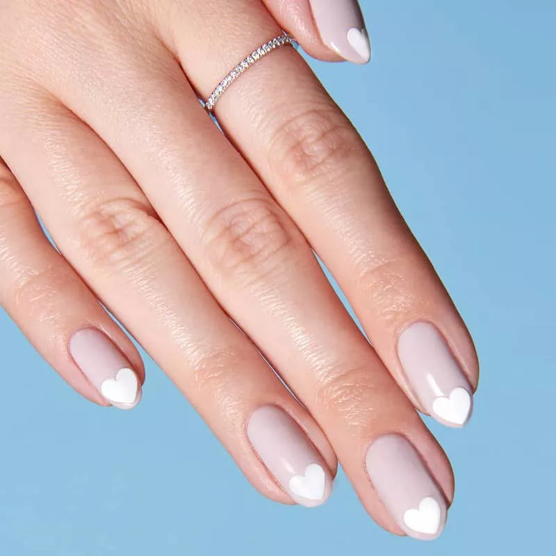 Pastel almond-shaped nails with white heart tips