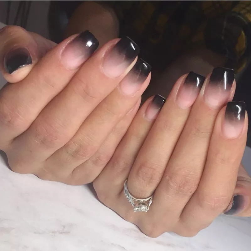 neutral pink fade into black ombre nails