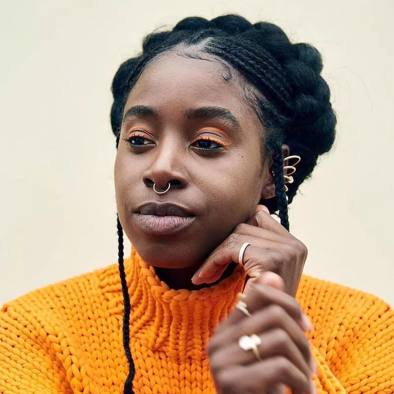 Kirby Howell-Baptiste wears orange double layered floating eyeliner and a septum piercing