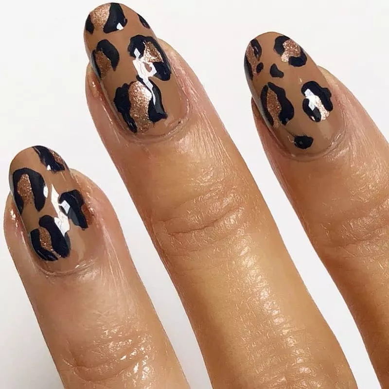 Almond-shaped nails with neutral leopard print design