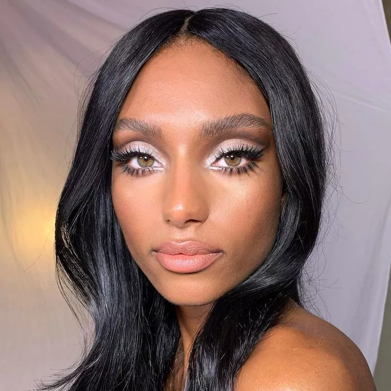 Model Sydney Harper wears silver eyeshadow with subtle eyeliner and lashes