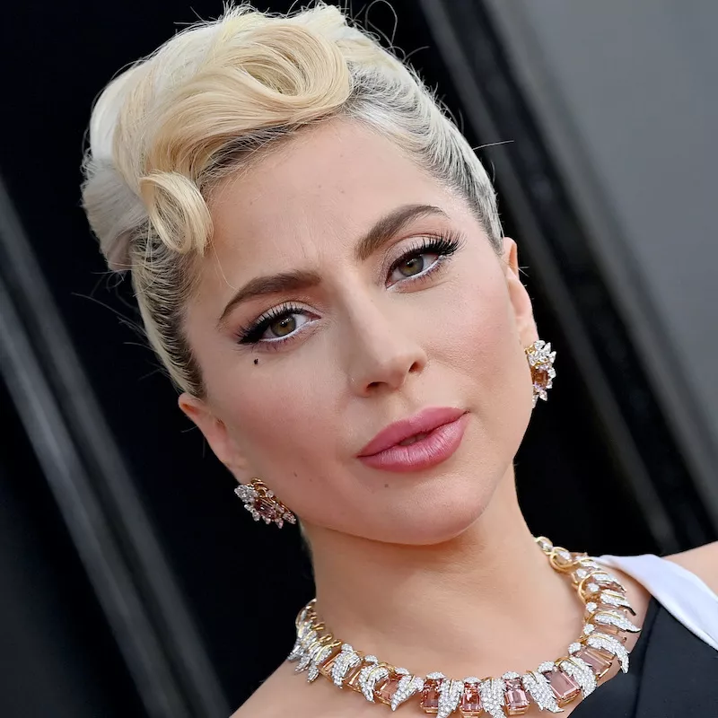 Lady Gaga wears black liquid eyeliner, lashes, and light pink lipstick