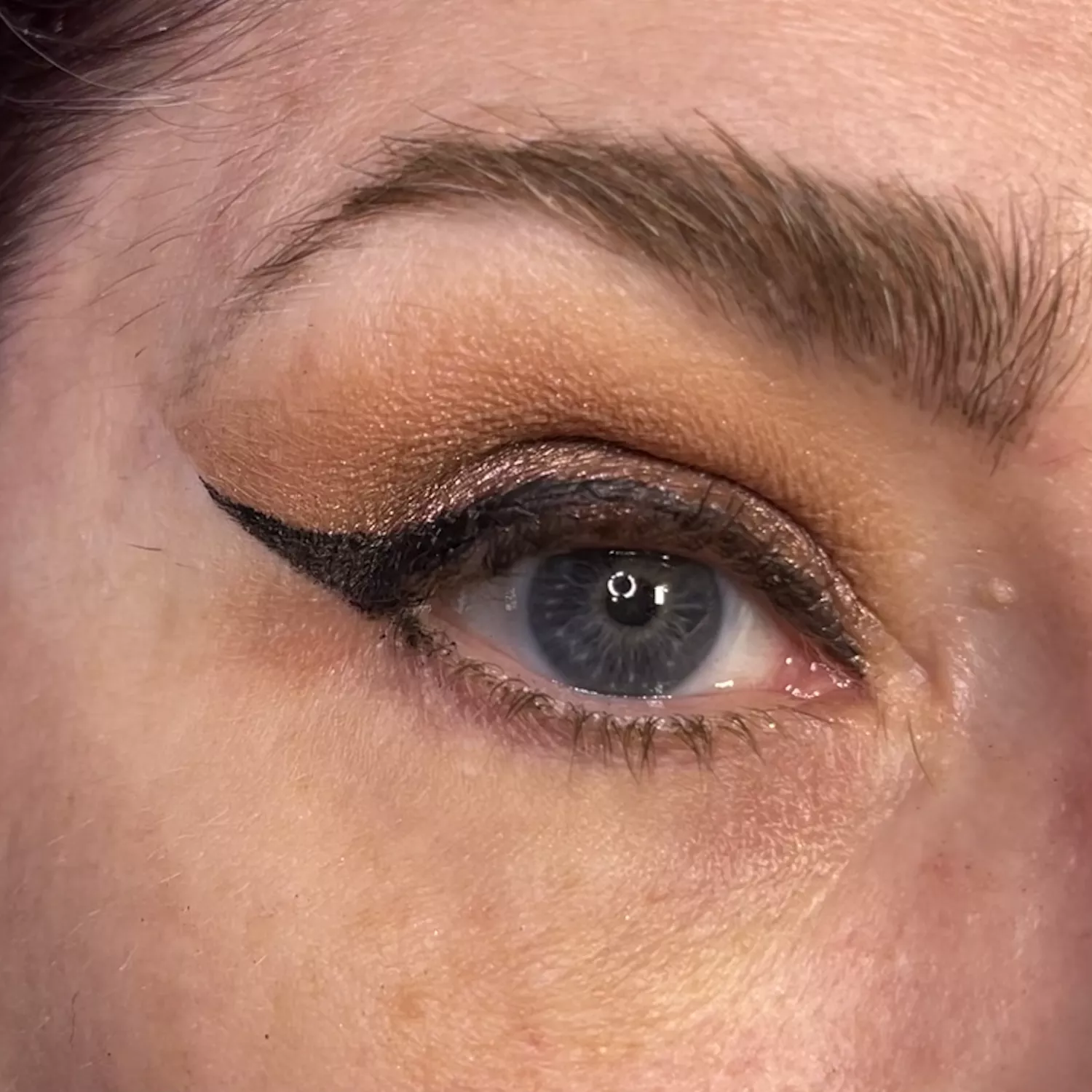 MAC makeup artist Keri Blair after removing the tape from her lid. 