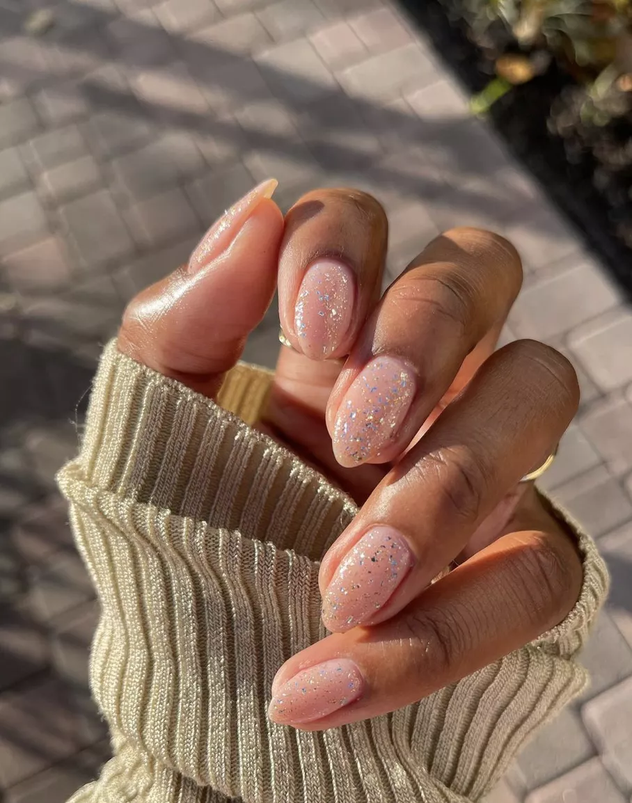 silver and gold confetti on clear nails