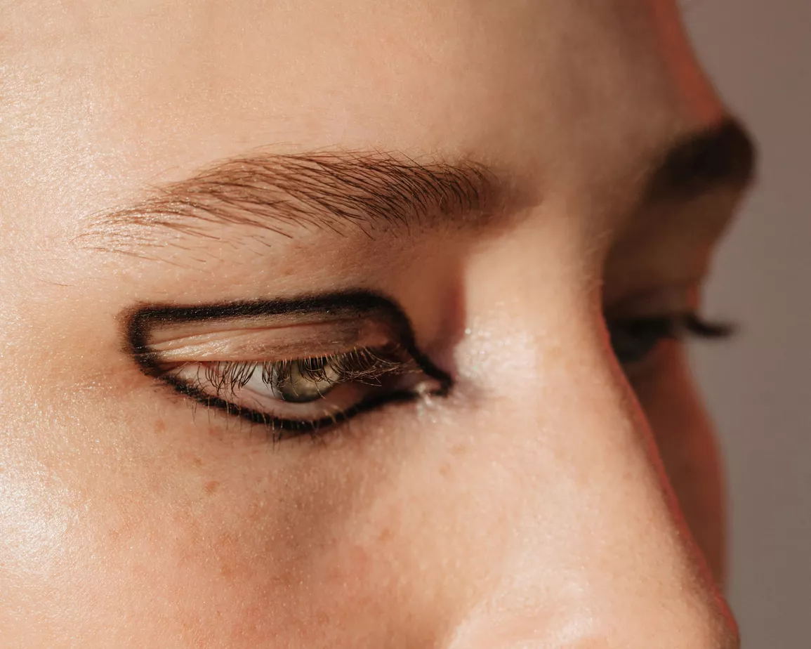 Close up of a woman's eye with a graphic eyeliner look
