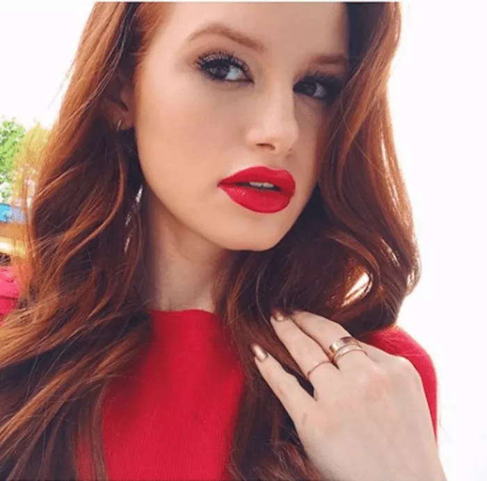 woman with red hair and red lipstick
