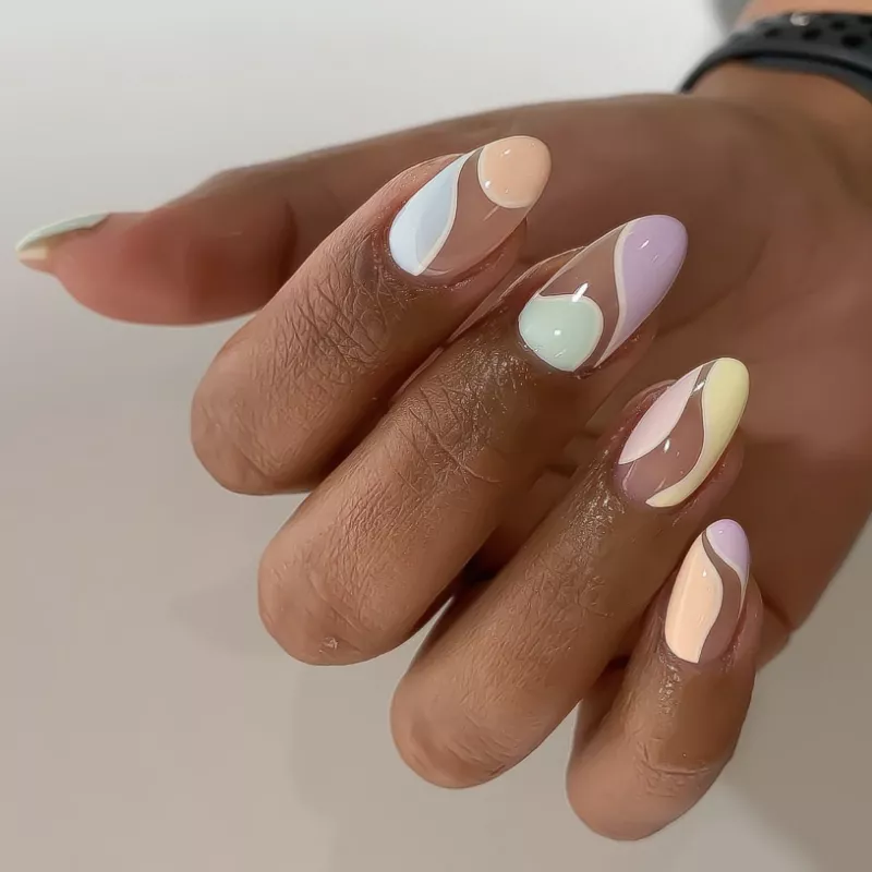 Swooping pastel negative space nail design