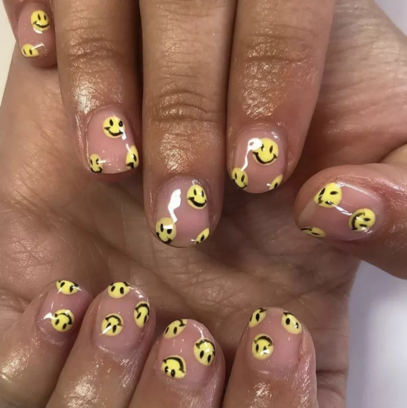 nail with mini smiley faces