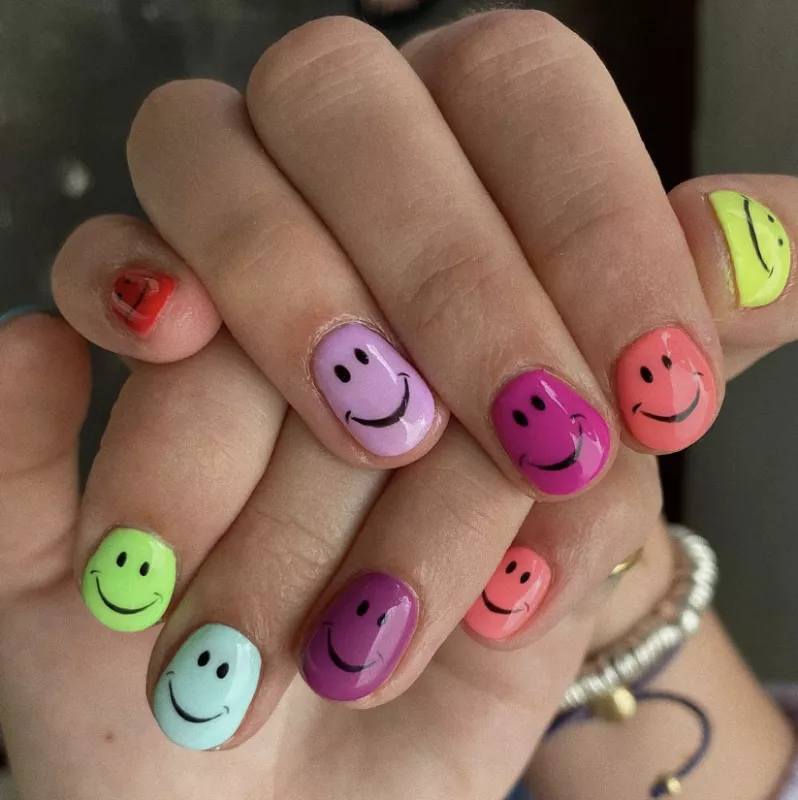 rainbow smiley face nail design