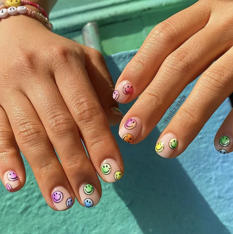nails with rainbow smiley faces