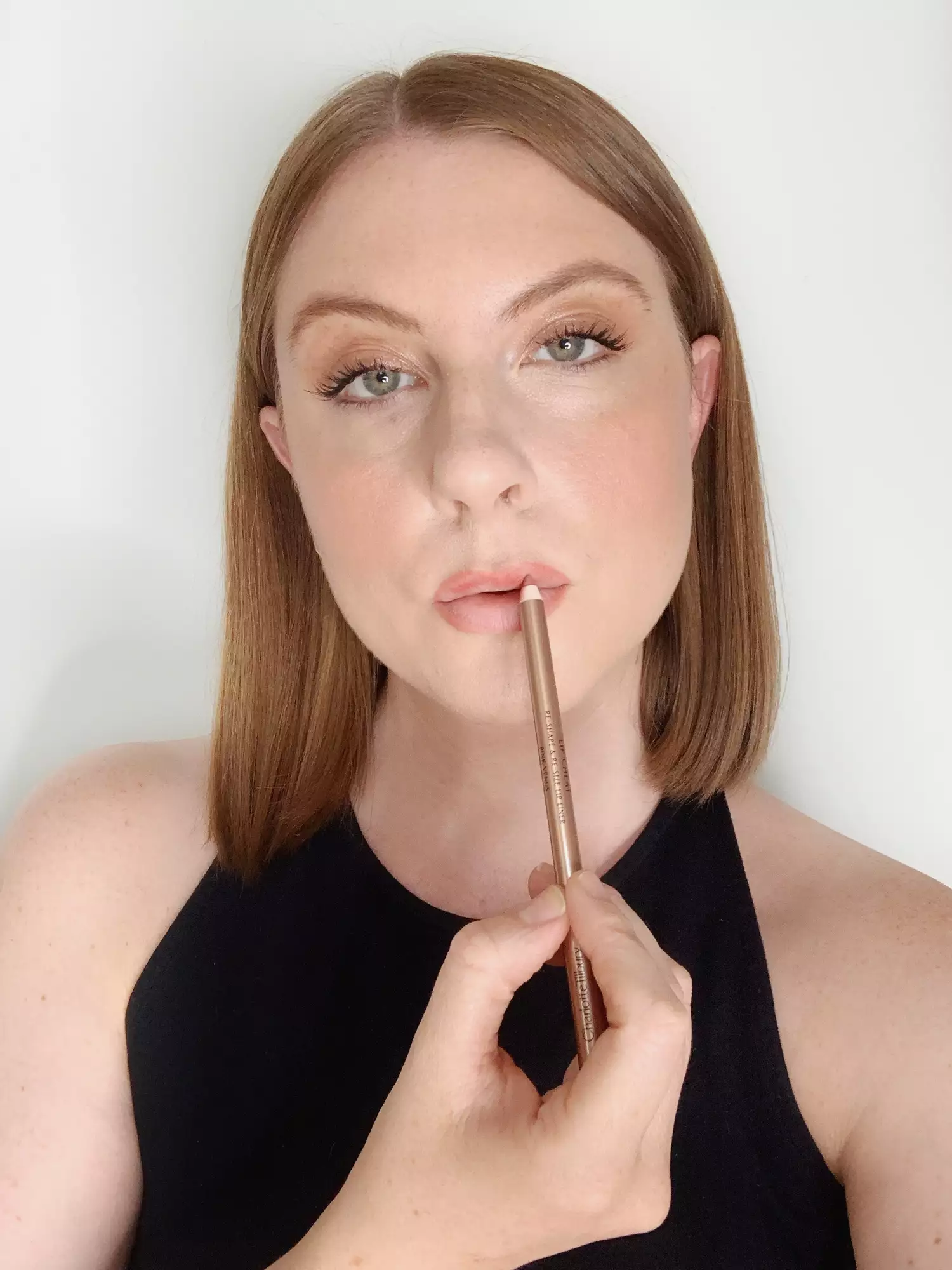 Ashley Rebecca creating fuller lips with lipliner pencil