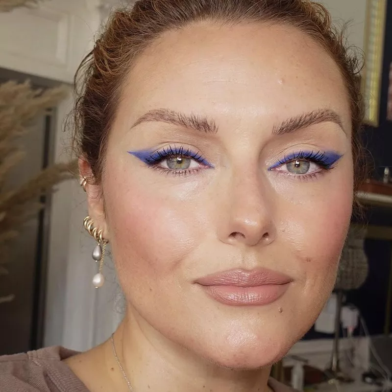 Makeup artist Katie Jane Hughes in smoky blue eyeliner