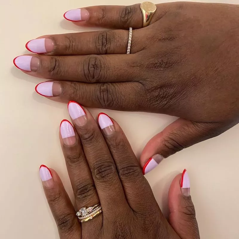 Double French manicure with wide lavender half and thin red tip