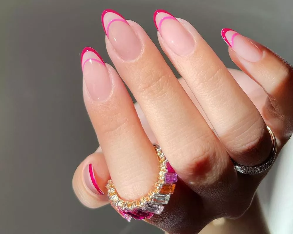 Double French manicure with two-toned pink tips and matching ring