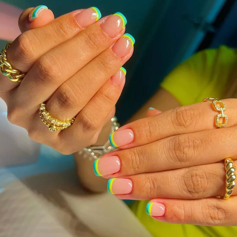 Double French manicure with neon green and yellow tips