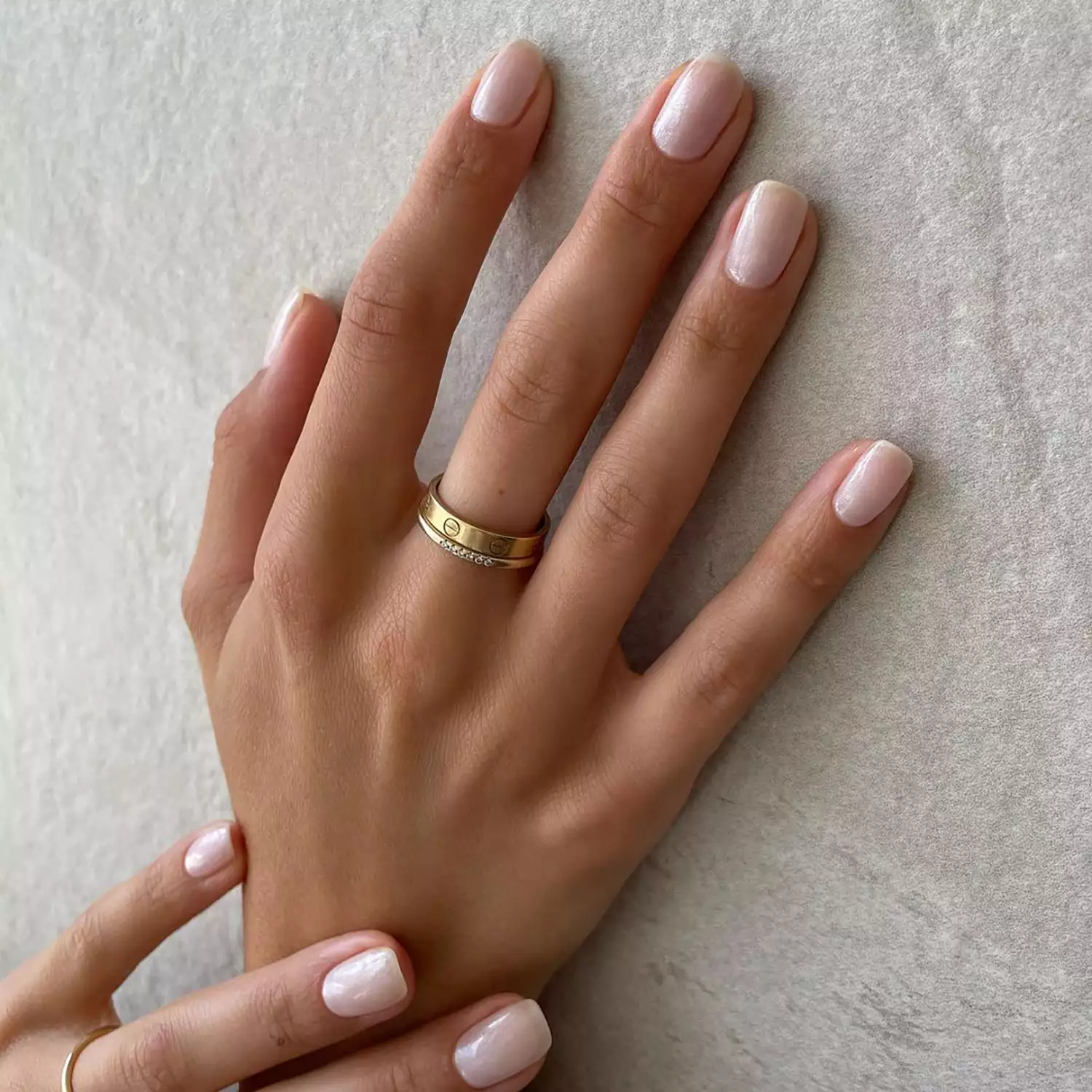 Close up of hands with a minimal mani